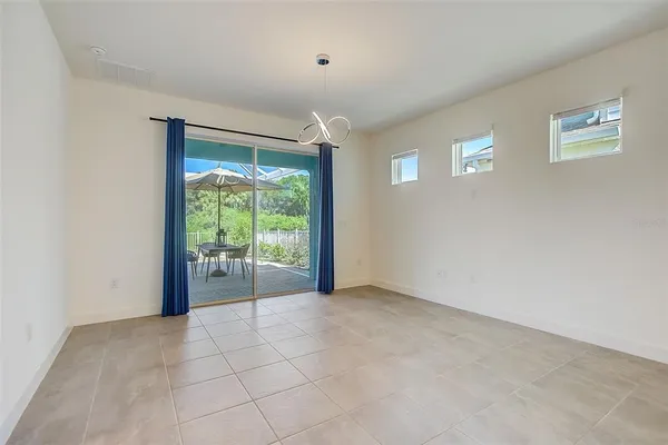 a view of an empty room with a fireplace