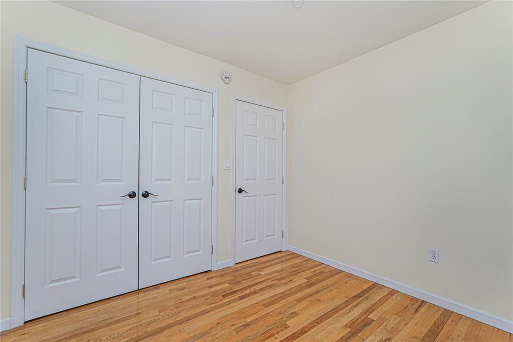 1838 West 13th Street, Unit 3B Brooklyn, NY 11223 - Photo 16 of 22 a view of a room with wooden floor