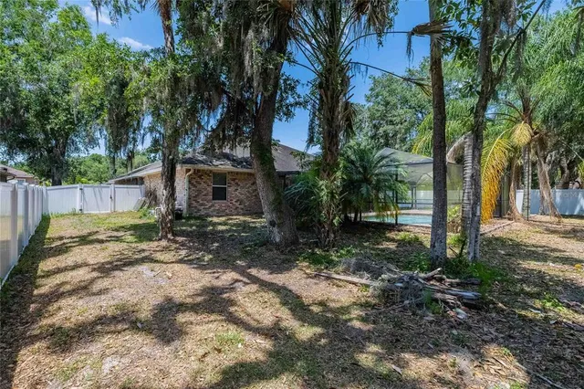a backyard of a house with lots of green space