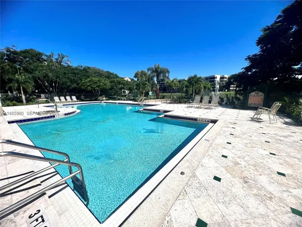 a view of a swimming pool with a patio