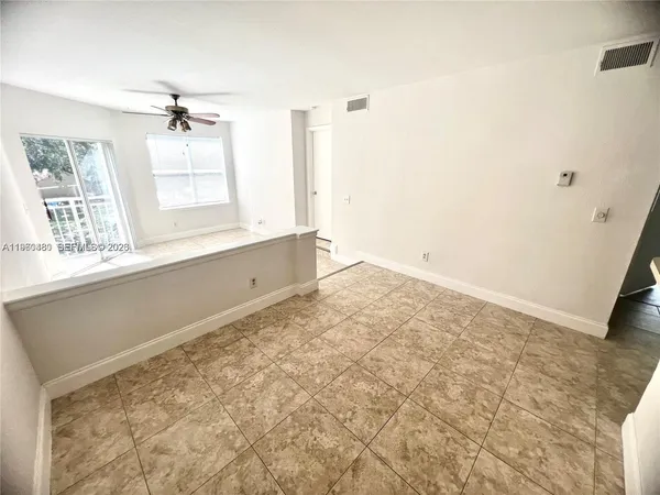 a view of an empty room and window