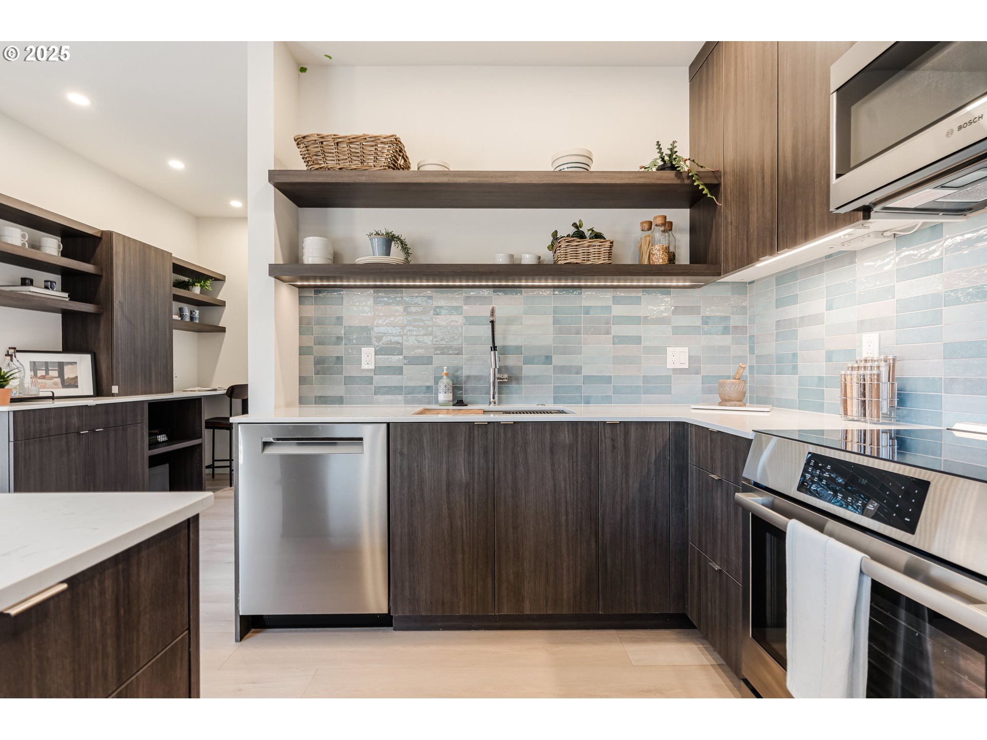 5490 Southeast Boise Street Portland, OR 97206 - Photo 13 of 48 a kitchen with stainless steel appliances granite countertop a refrigerator and a stove