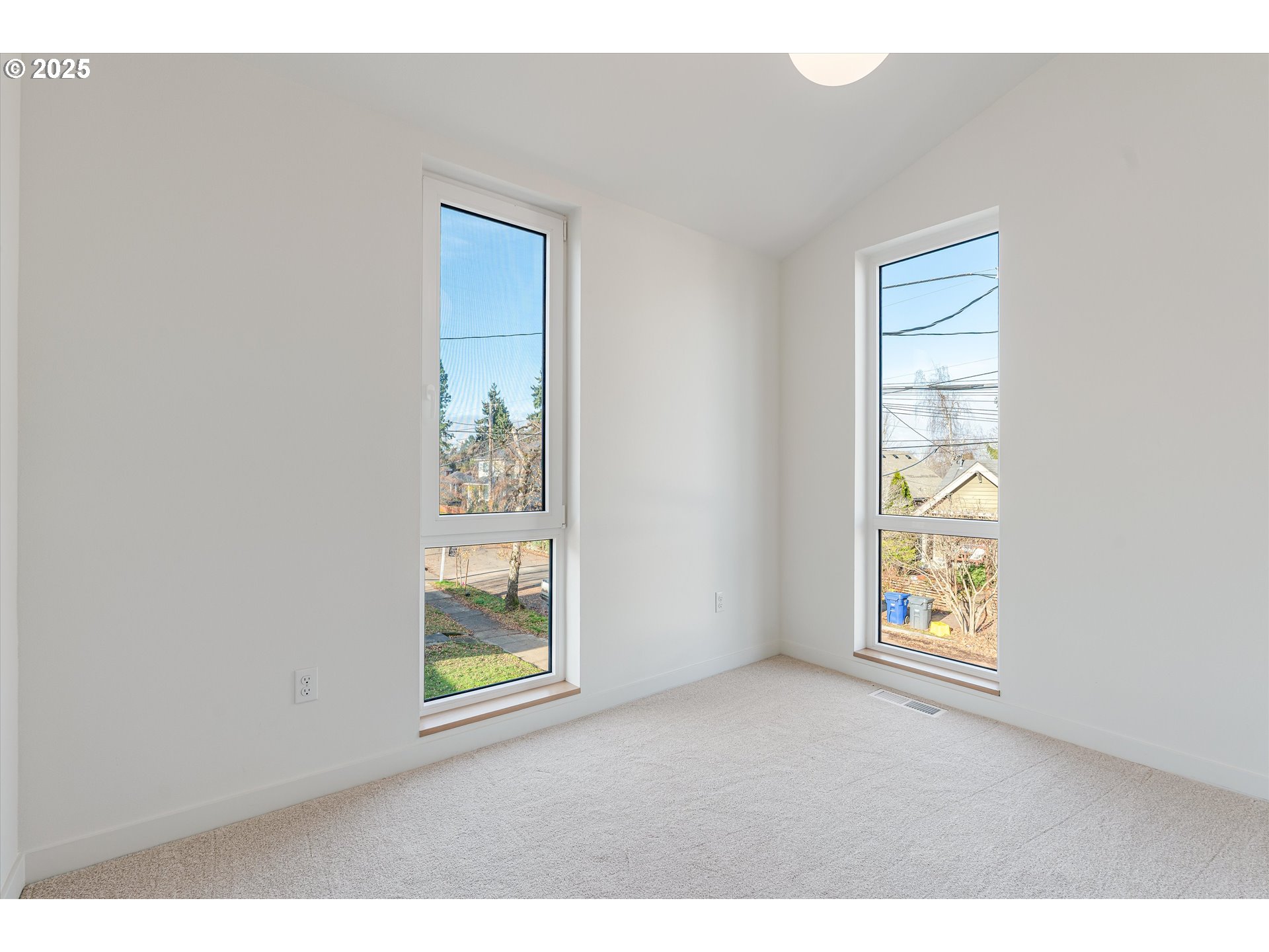 5490 Southeast Boise Street Portland, OR 97206 - Photo 27 of 48 an empty room with windows