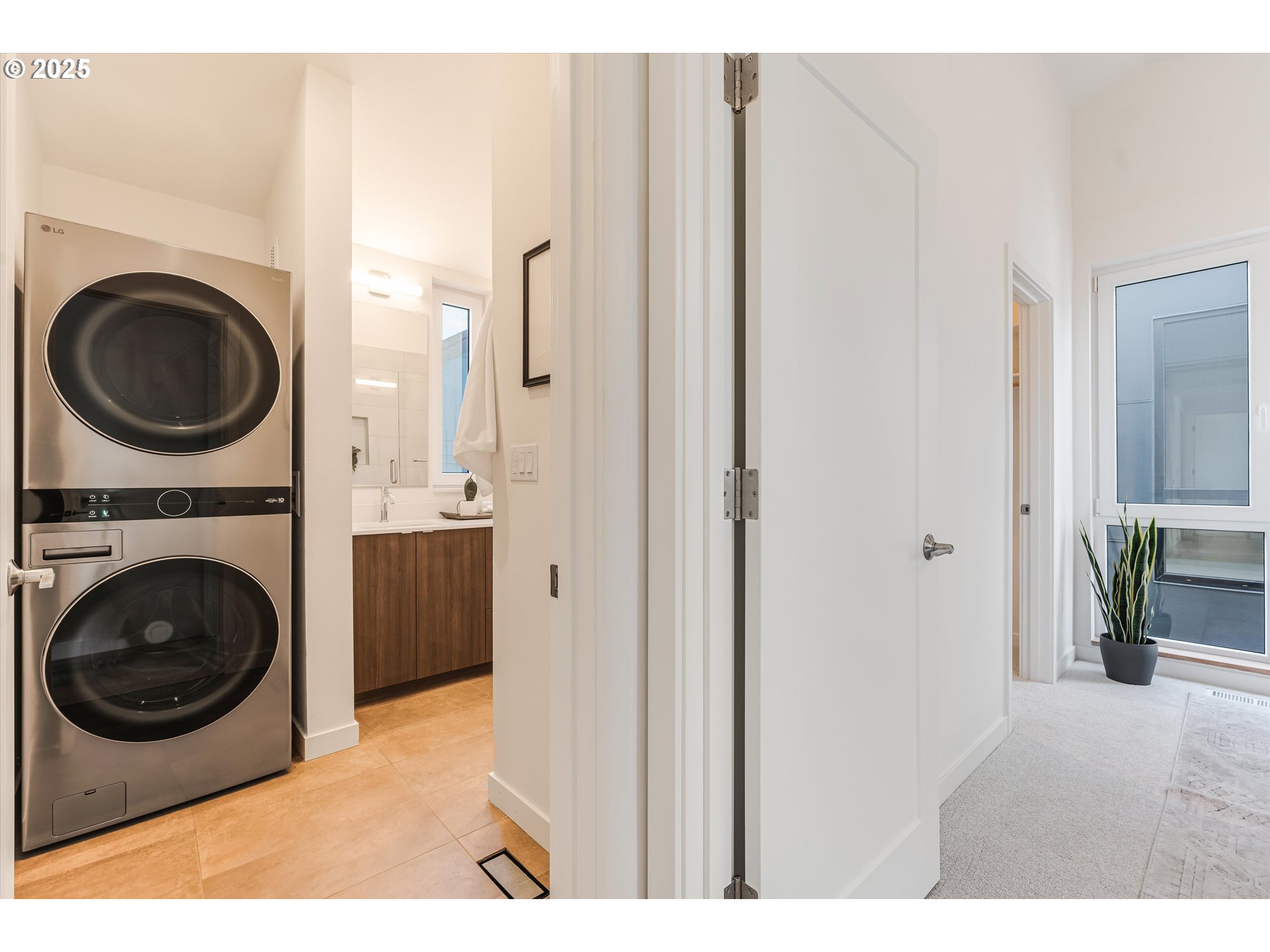 5490 Southeast Boise Street Portland, OR 97206 - Photo 31 of 48 a view of a bedroom with washer and dryer