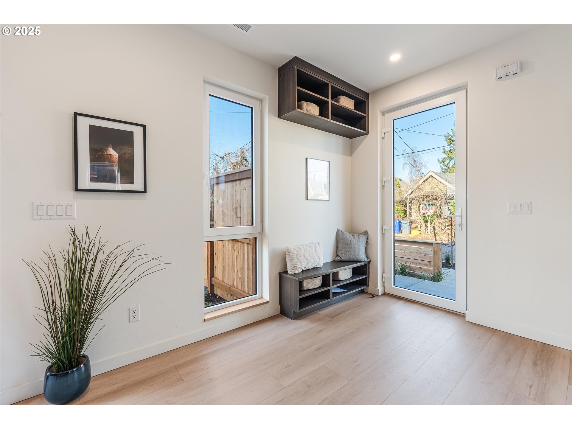 5490 Southeast Boise Street Portland, OR 97206 - Photo 5 of 48 a living room with furniture and a potted plant