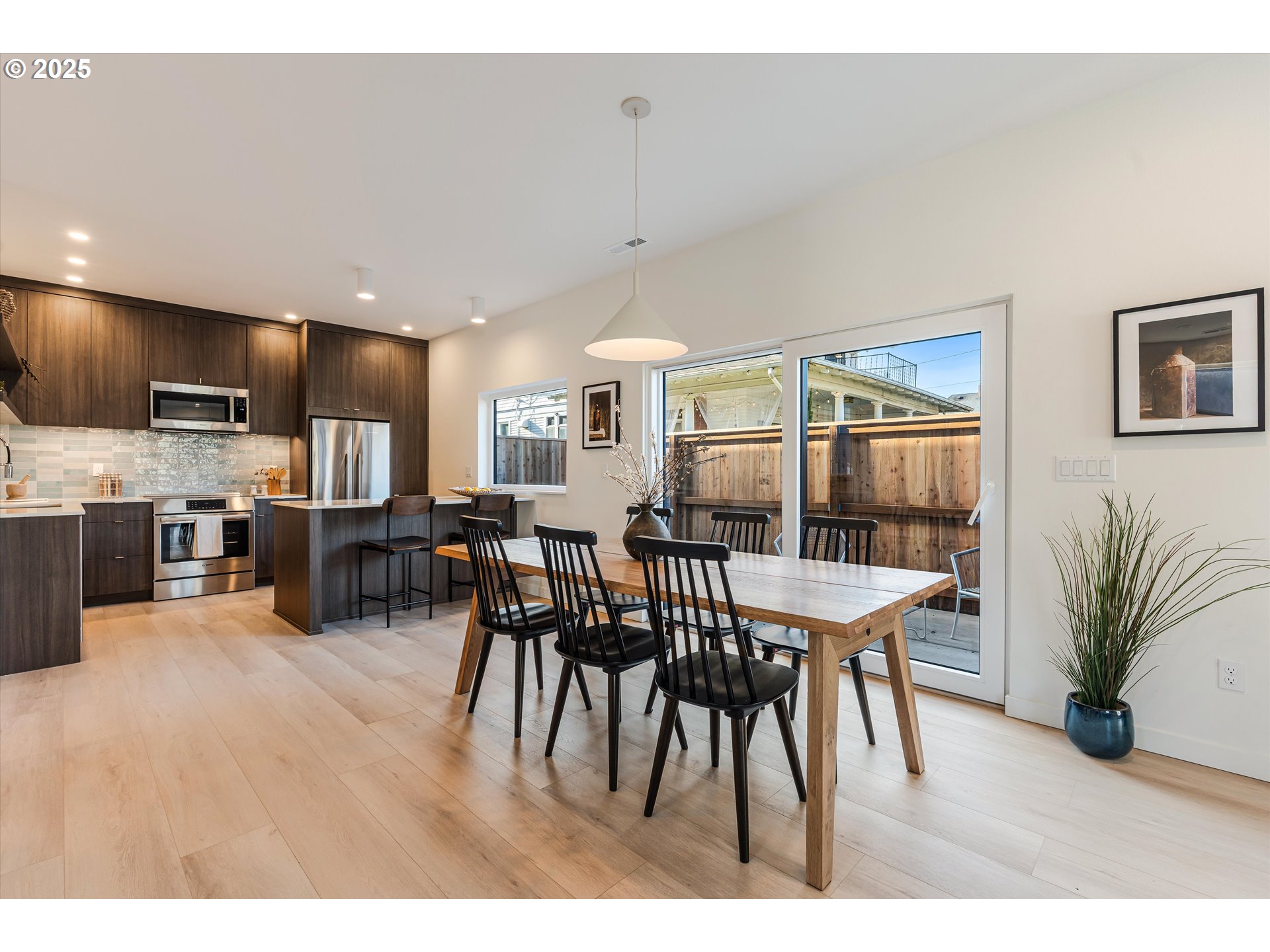 5490 Southeast Boise Street Portland, OR 97206 - Photo 9 of 48 a dining room with furniture and wooden floor