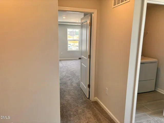 a view of a livingroom and a hallway