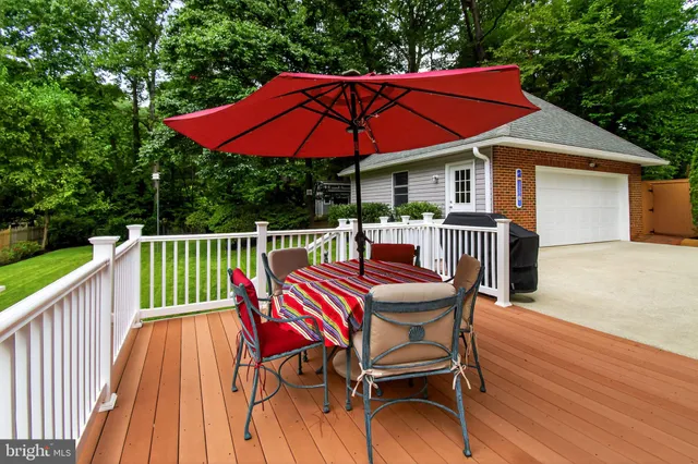 a view of a chair and table on the deck