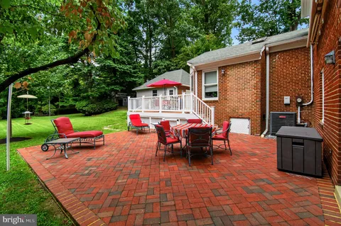 an outdoor space with furniture and garden