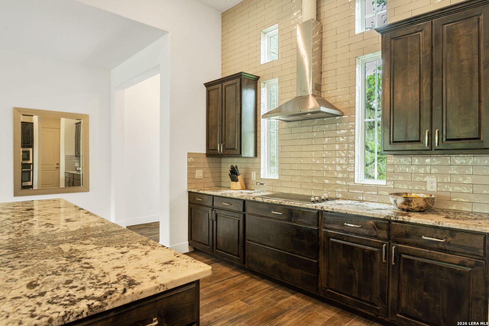 1465 Ironwood Road Fischer, TX 78623 - Photo 13 of 38 a kitchen with granite countertop sink and cabinets