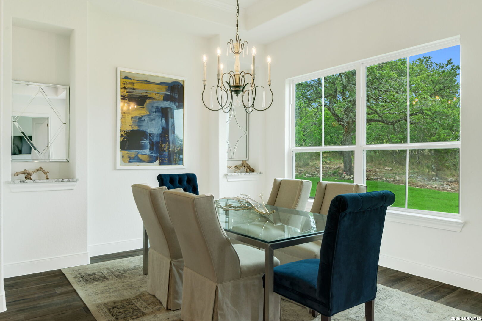 1465 Ironwood Road Fischer, TX 78623 - Photo 16 of 38 a dining room with furniture a chandelier and wooden floor