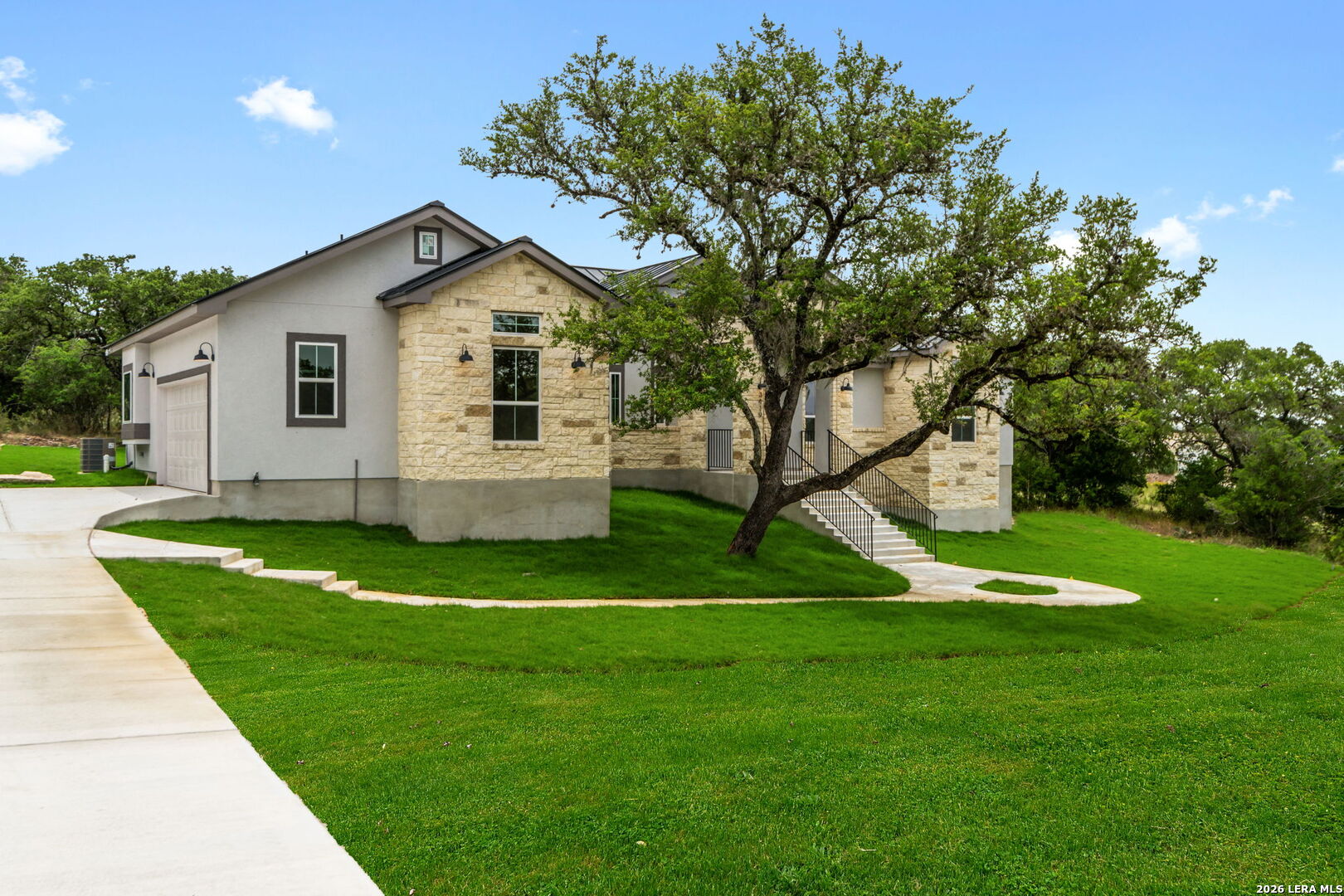 1465 Ironwood Road Fischer, TX 78623 - Photo 2 of 38 a house view with a garden space