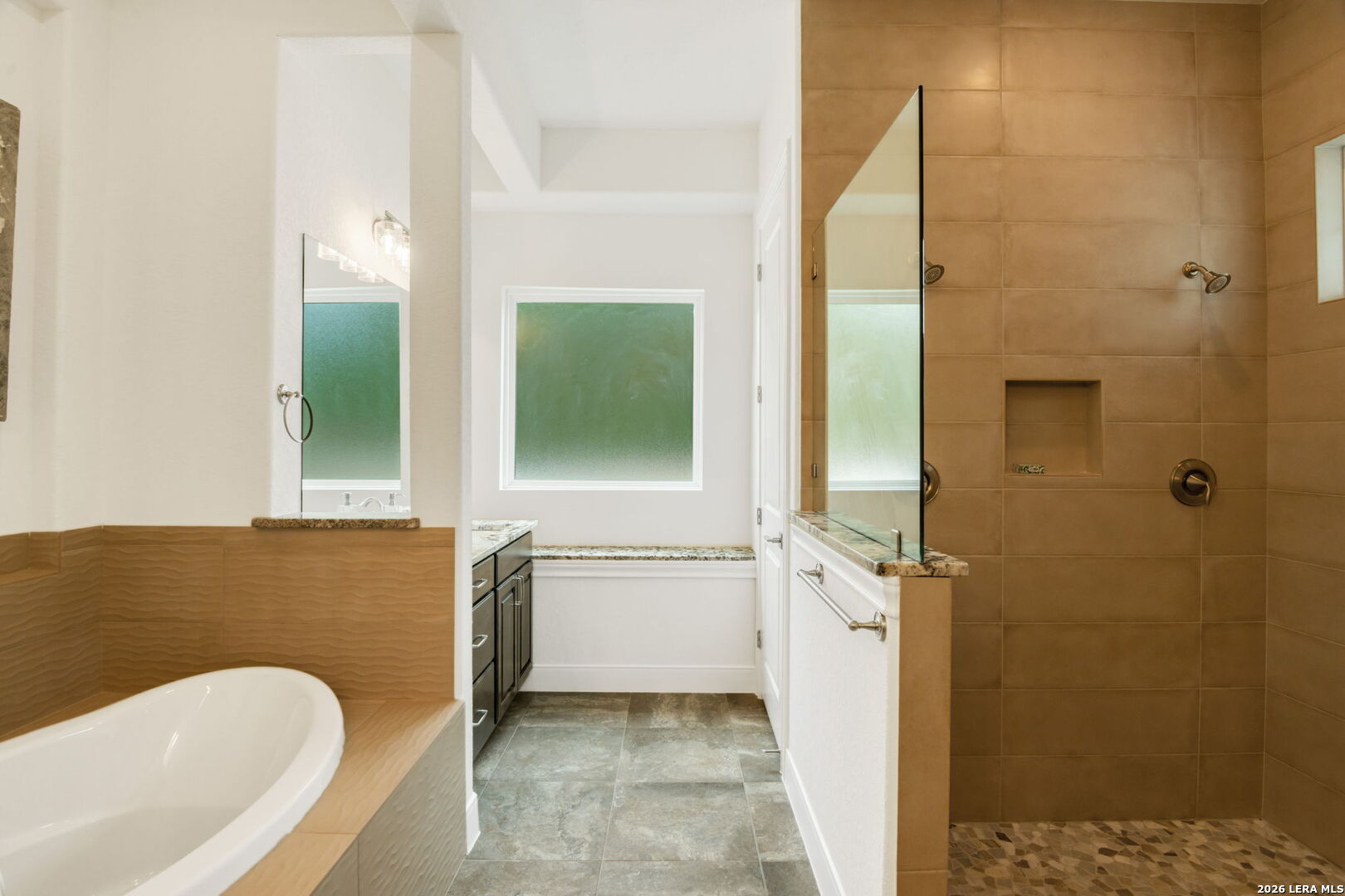 1465 Ironwood Road Fischer, TX 78623 - Photo 25 of 38 a bathroom with a granite countertop sink and a bathtub