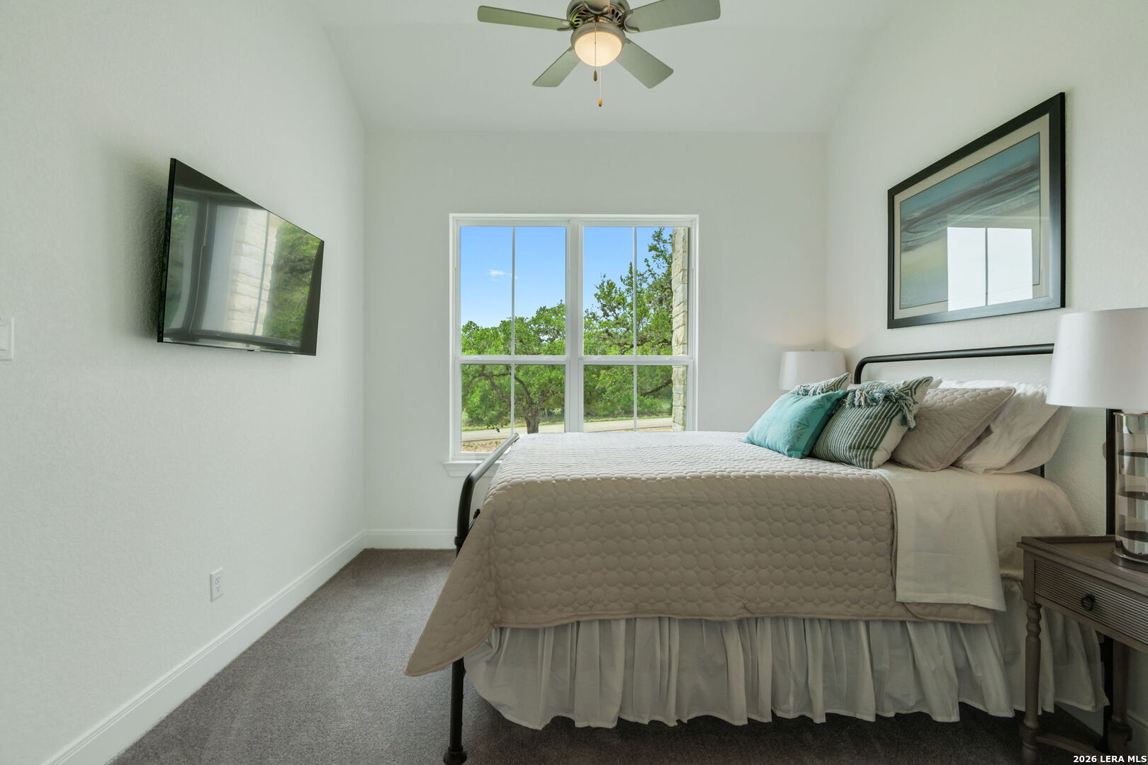 1465 Ironwood Road Fischer, TX 78623 - Photo 26 of 38 a bed sitting in a bedroom next to a window