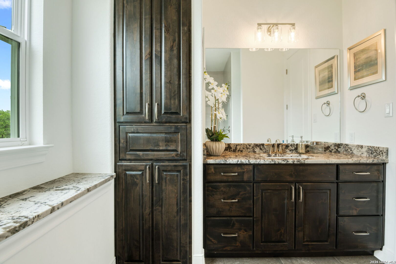 1465 Ironwood Road Fischer, TX 78623 - Photo 28 of 38 a bathroom with a granite countertop sink and a mirror