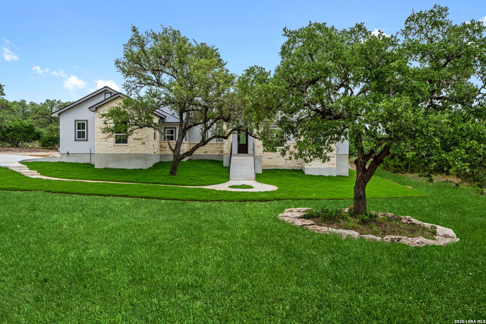 1465 Ironwood Road Fischer, TX 78623 - Photo 3 of 38 a front view of a house with garden