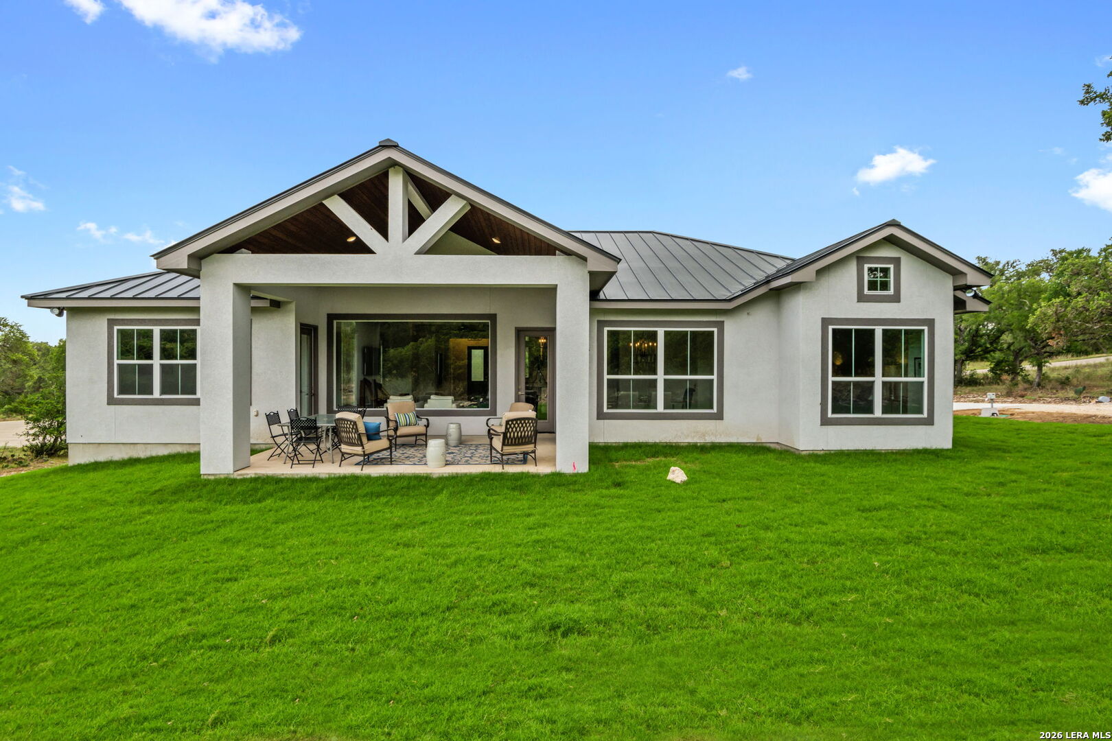 1465 Ironwood Road Fischer, TX 78623 - Photo 31 of 38 a front view of a house with a garden and porch