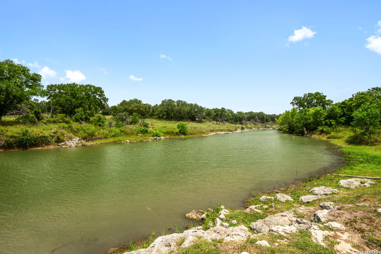 1465 Ironwood Road Fischer, TX 78623 - Photo 36 of 38 a view of a lake with a mountain