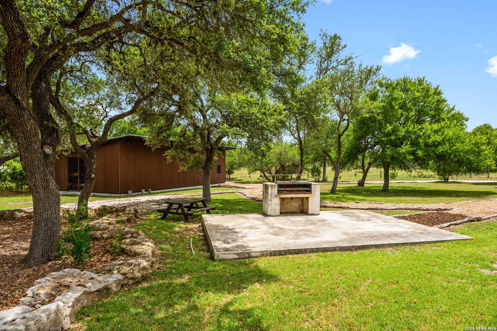 1465 Ironwood Road Fischer, TX 78623 - Photo 38 of 38 a view of a backyard with large trees