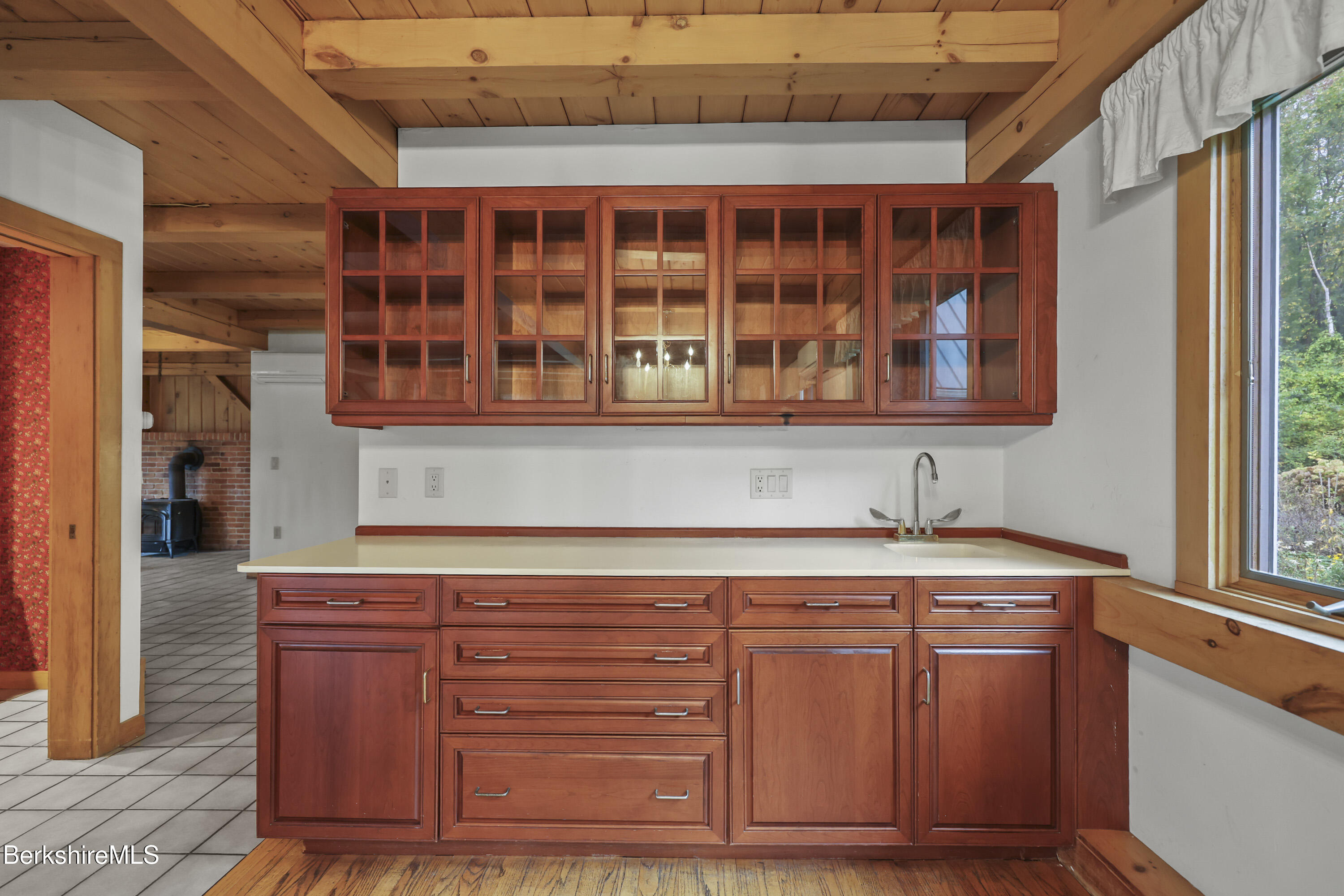 1030 Simonds Road Williamstown, MA 01267 - Photo 11 of 76 a view of cabinets with wooden floor and windows