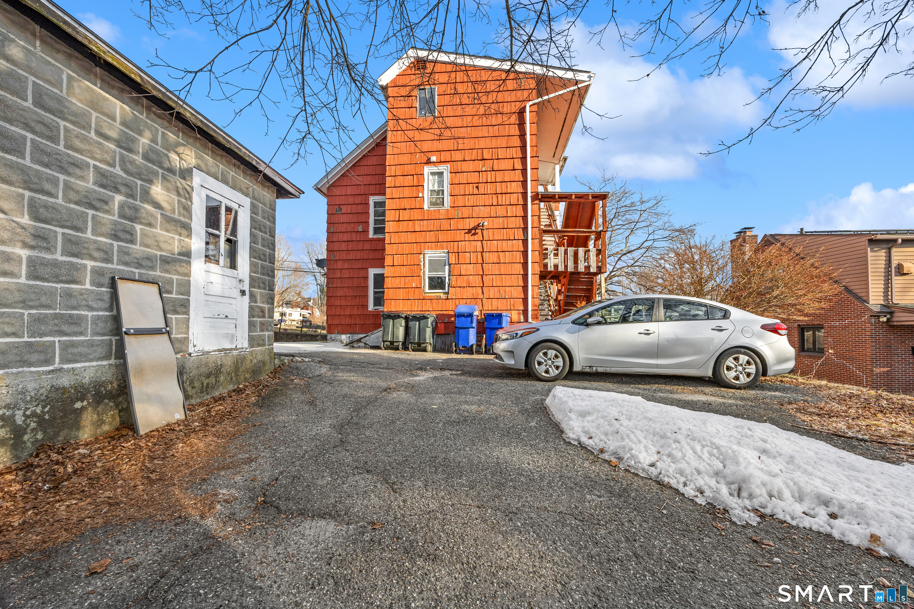153 Funston Avenue, Unit 1 Torrington, CT 06790 - Photo 13 of 16 a view of a car parked in front of a building