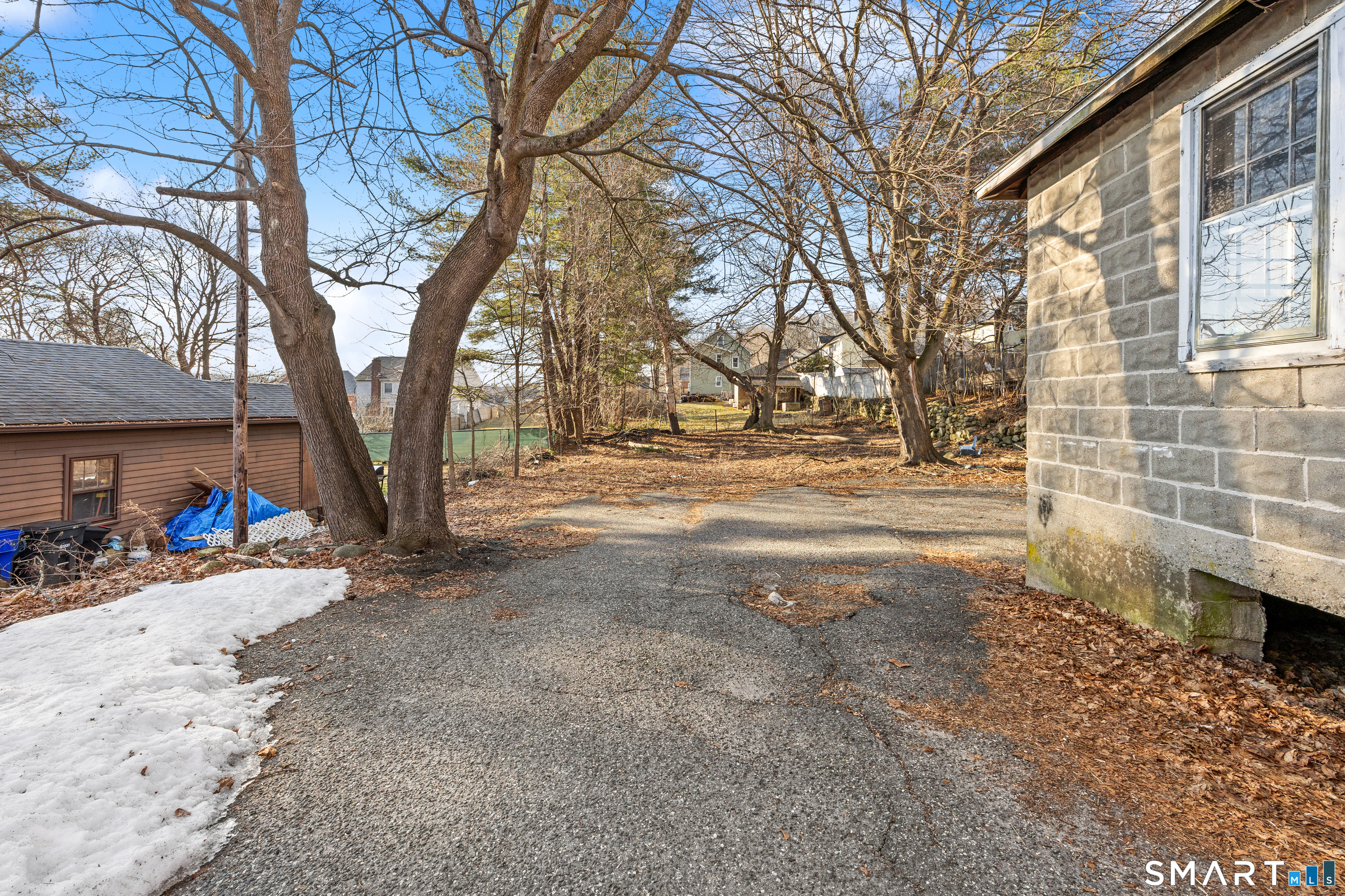 153 Funston Avenue, Unit 1 Torrington, CT 06790 - Photo 15 of 16 a view of road with trees
