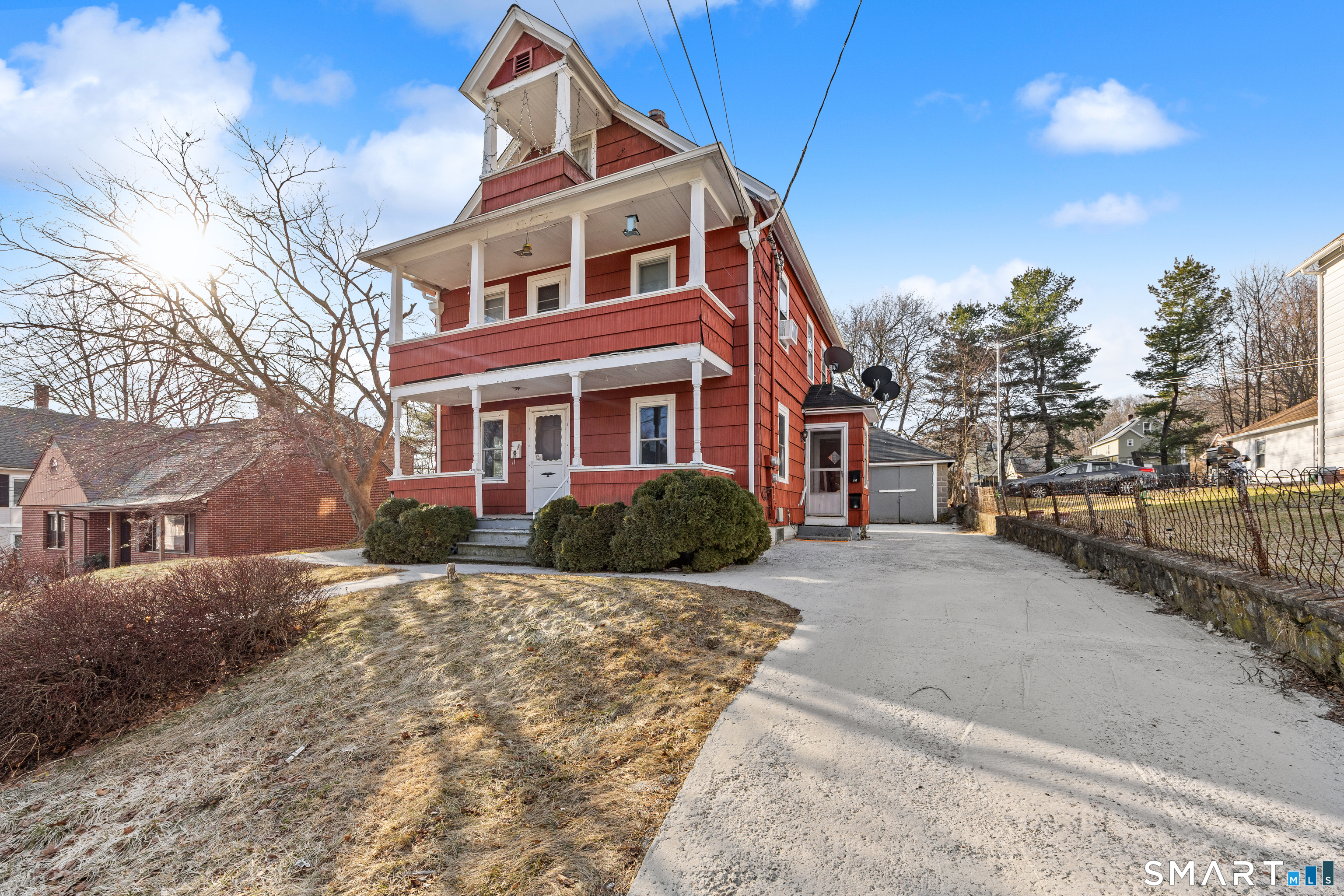 153 Funston Avenue, Unit 1 Torrington, CT 06790 - Photo 2 of 16 a front view of a house with a yard