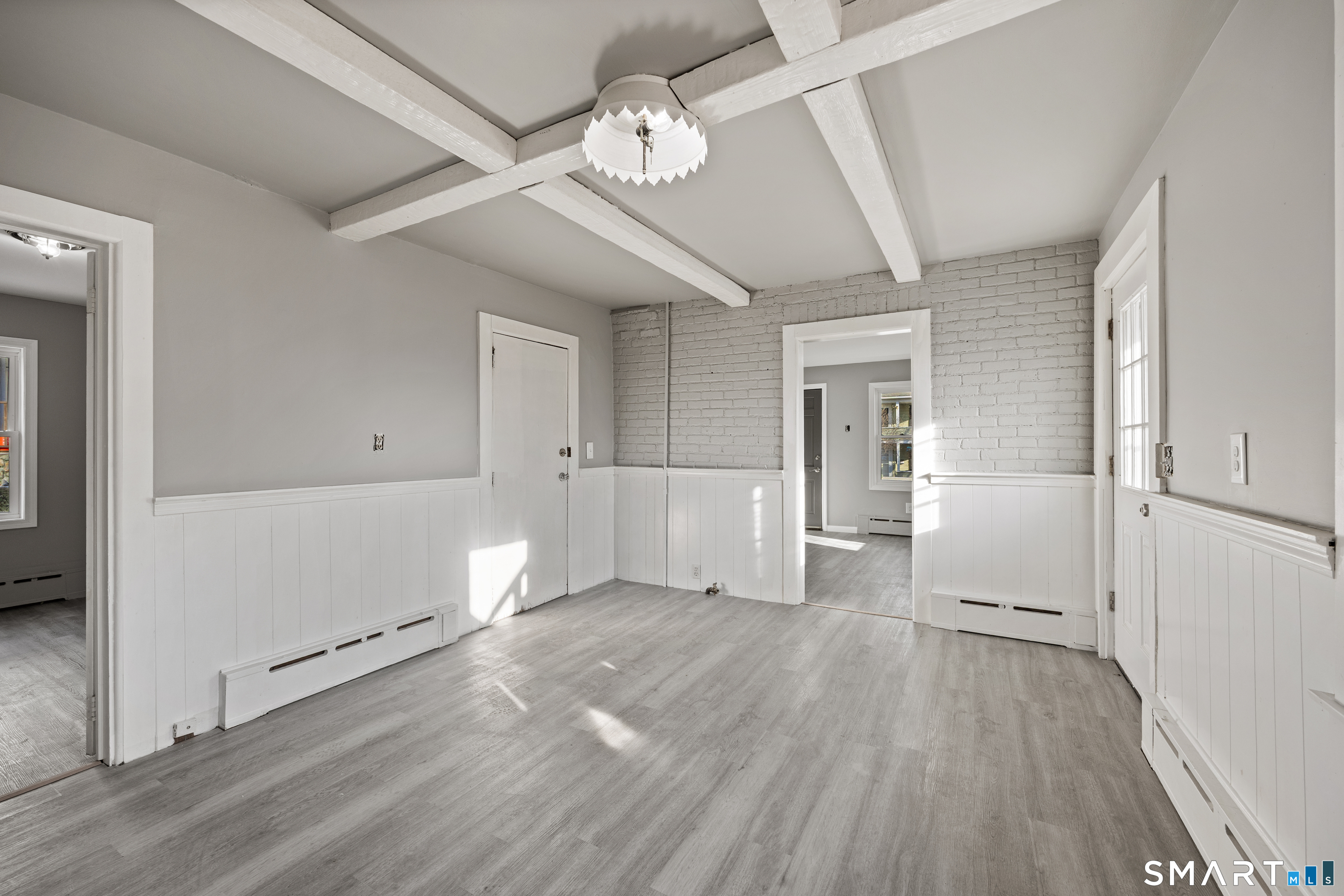 153 Funston Avenue, Unit 1 Torrington, CT 06790 - Photo 4 of 16 a view of empty room with wooden floor