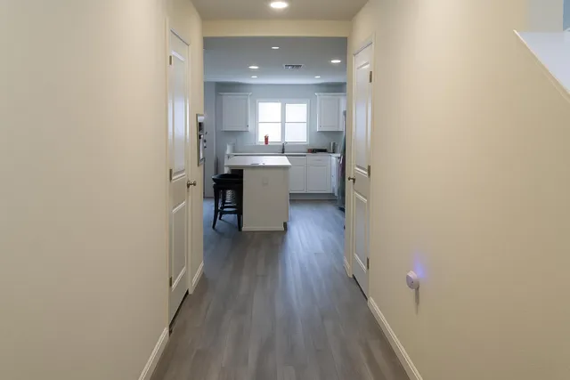 a view of a kitchen from the hallway