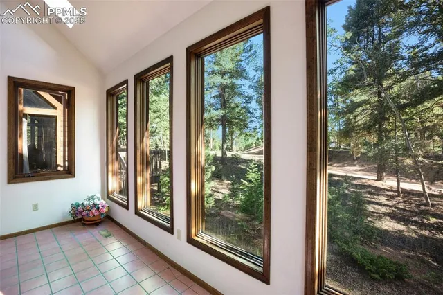 a view of a room that has a large window