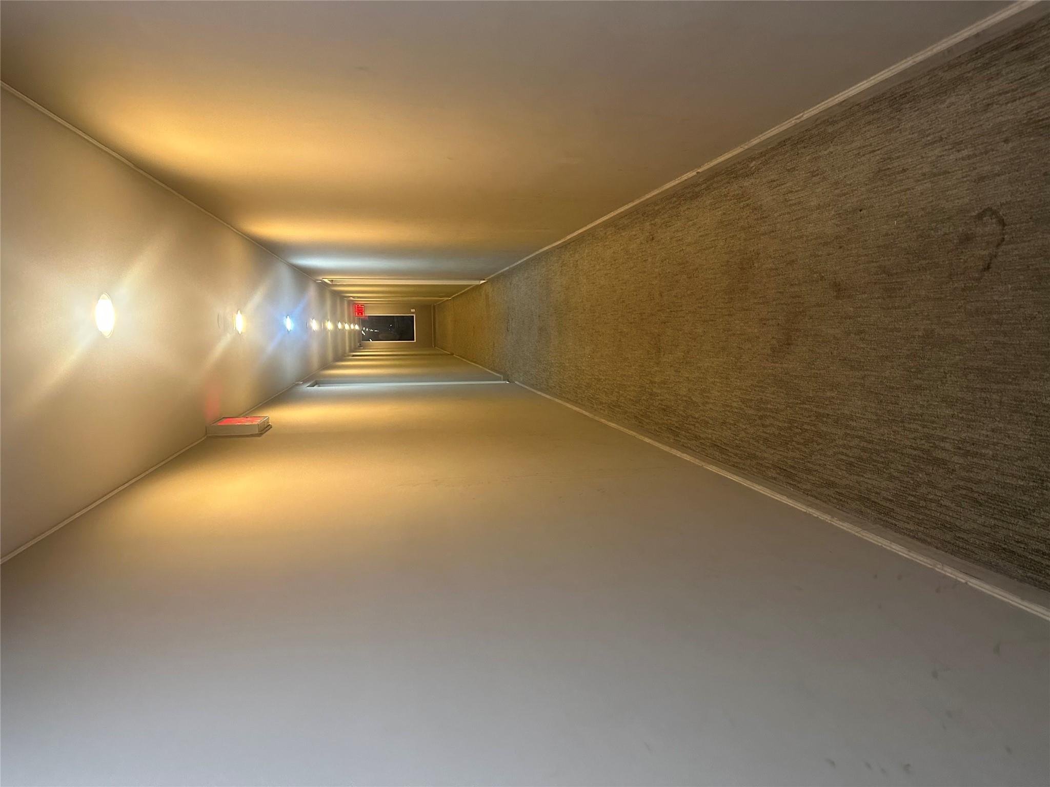 112-02 Northern Boulevard Queens, NY 11368 - Photo 11 of 11 Hallway with carpet and baseboards