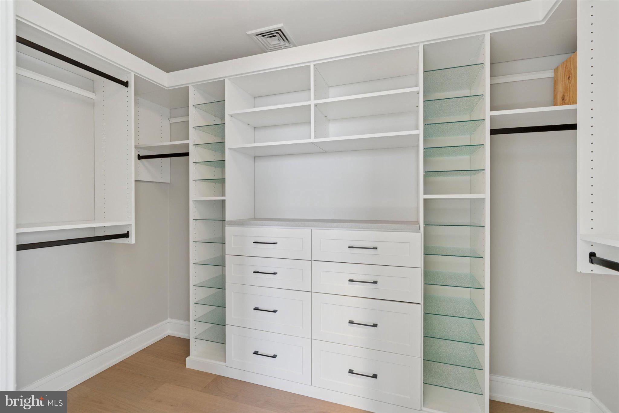 50 North Main Street, Unit 302 Doylestown, PA 18901 - Photo 20 of 38 Sleek, modern closet with ample storage.