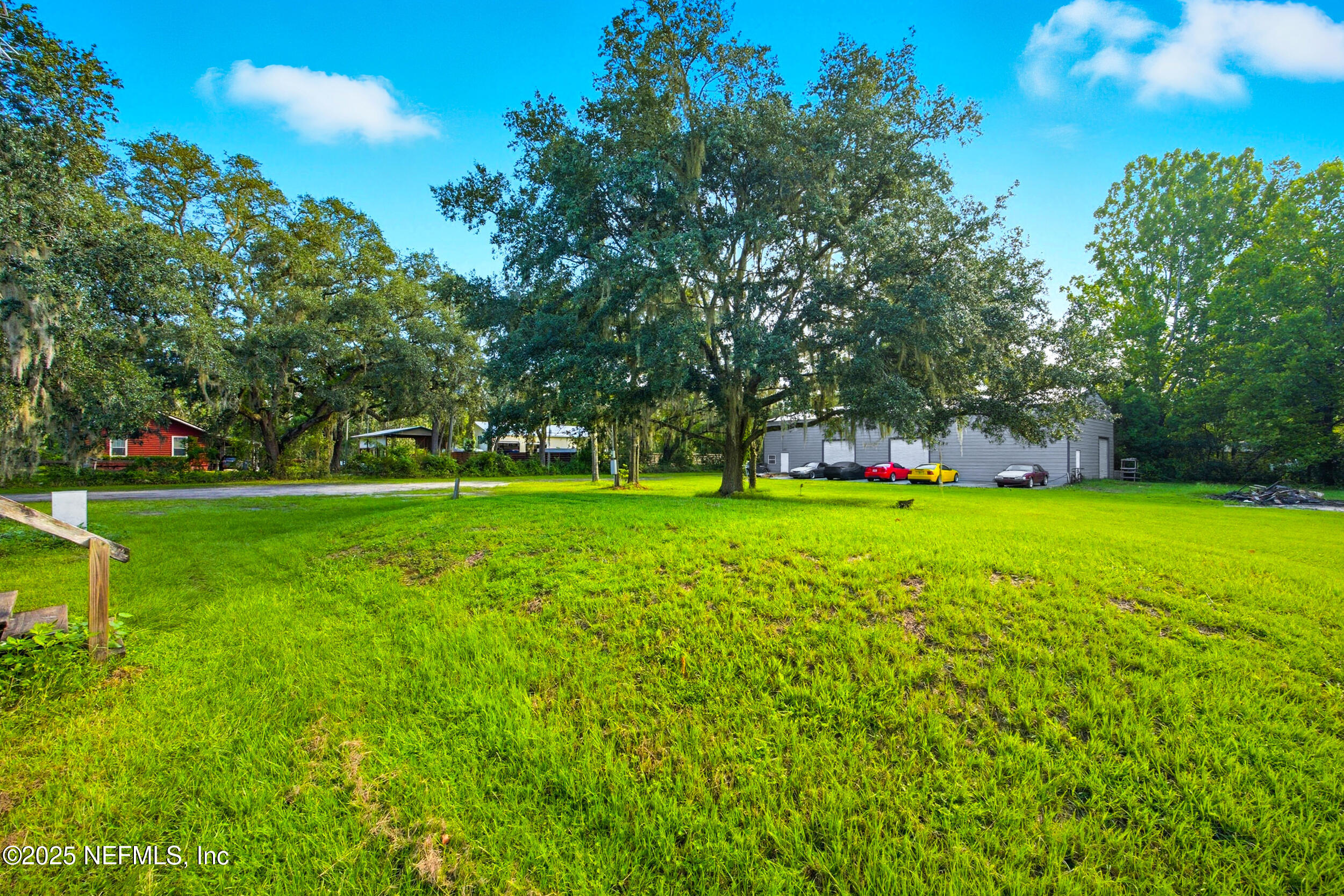3250 Pacetti Road St. Augustine, FL 32092 - Photo 18 of 31 a view of green field with tree in the background