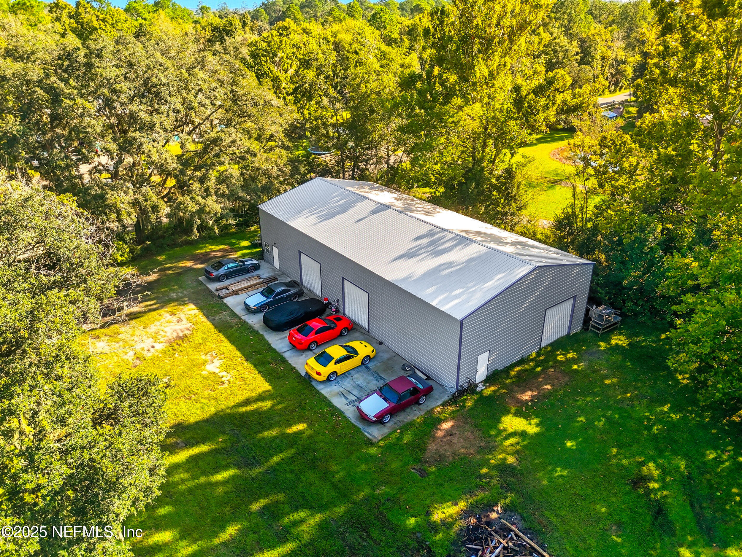 3250 Pacetti Road St. Augustine, FL 32092 - Photo 29 of 31 a view of a backyard with plants and large tree