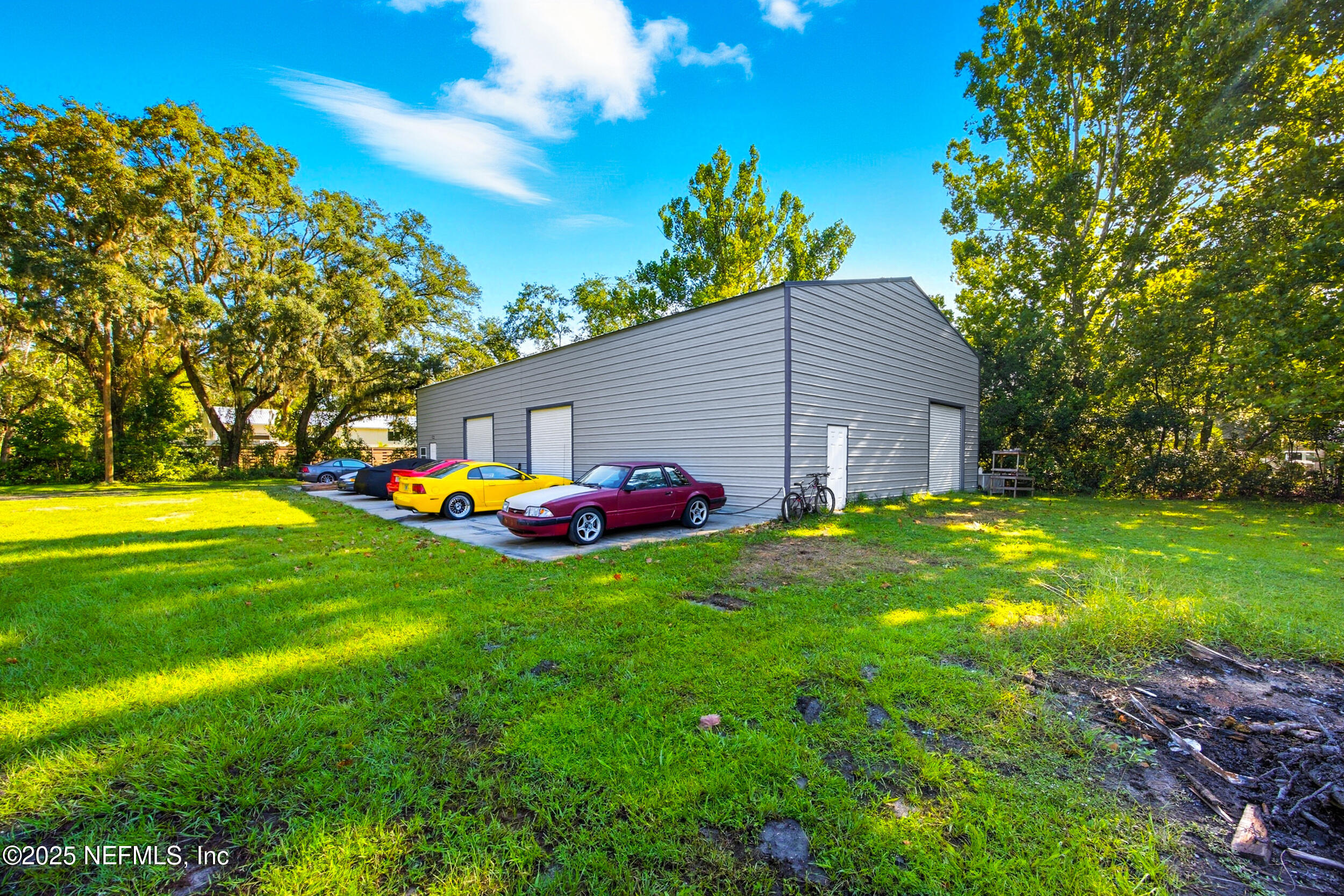 3250 Pacetti Road St. Augustine, FL 32092 - Photo 8 of 31 a view of backyard with table and chairs plants and large trees