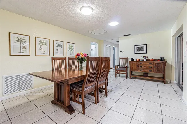 a bed room with a bed and a ceiling fan