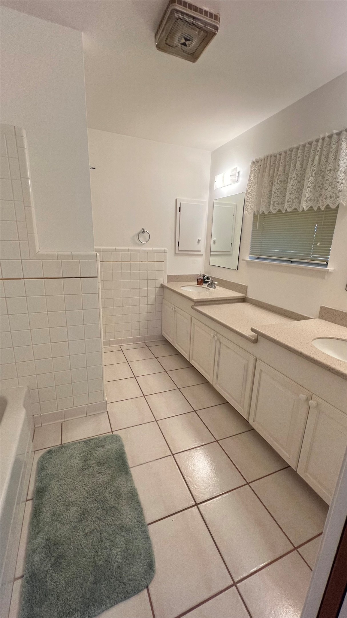 402 Peach Point Road Jones Creek, TX 77541 - Photo 24 of 32 Primary bath with double sinks and vanity area