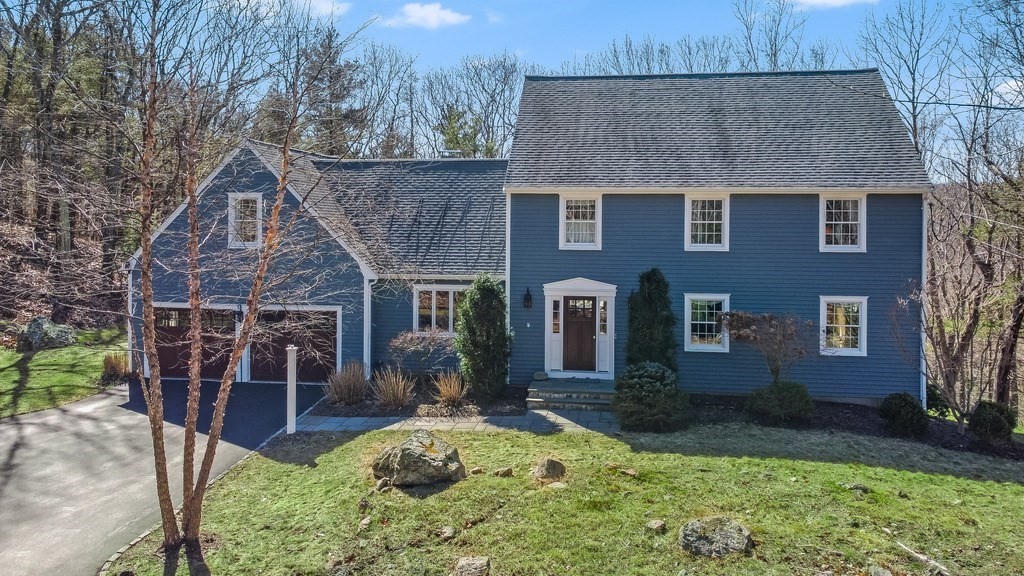 39 Rolling Lane Dover, MA 02030 - Photo 1 of 28 a front view of a house with garden
