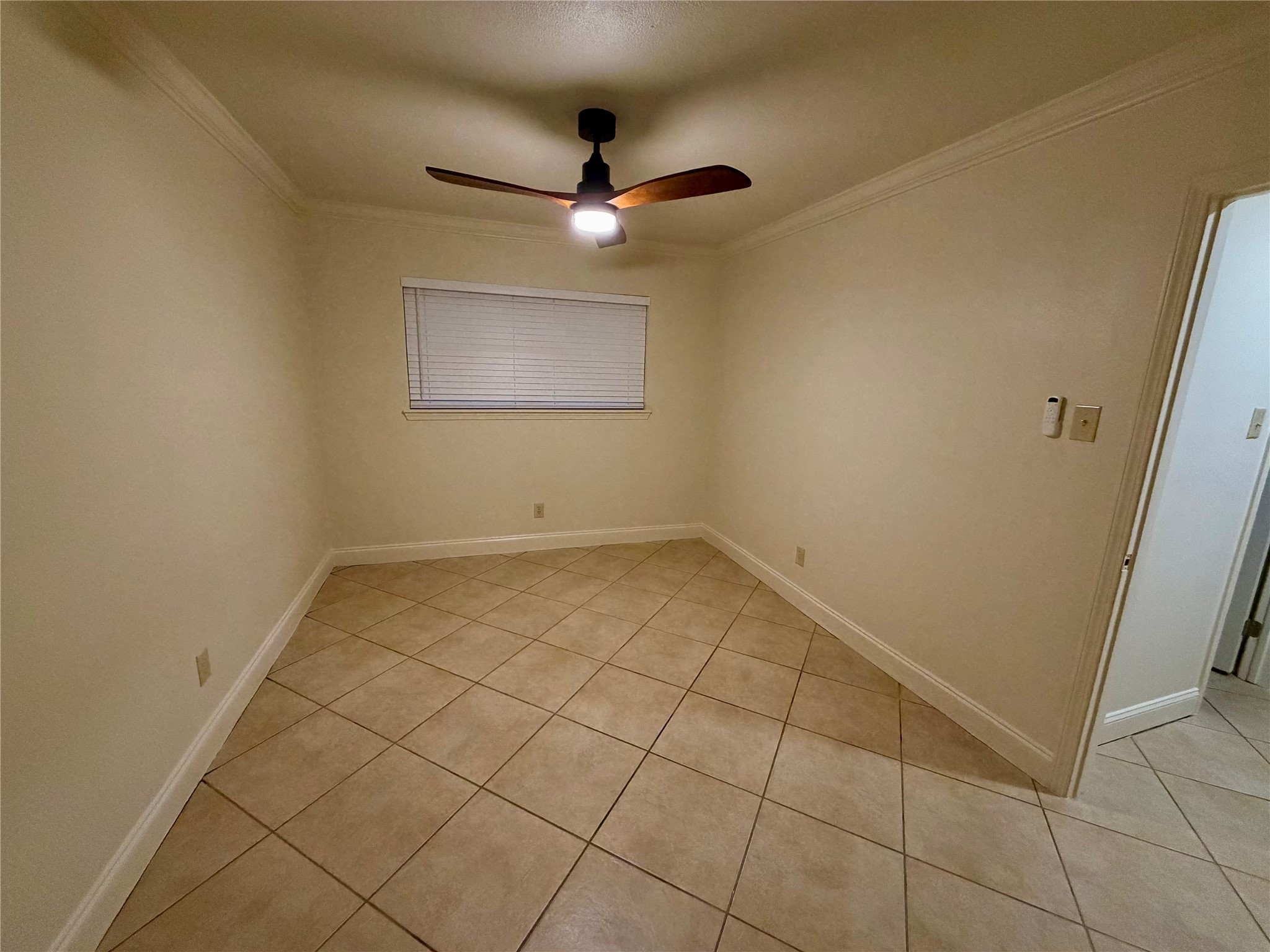 2812 Wichita Street, Unit 6 Houston, TX 77004 - Photo 11 of 15 an empty room with a ceiling fan and carpet