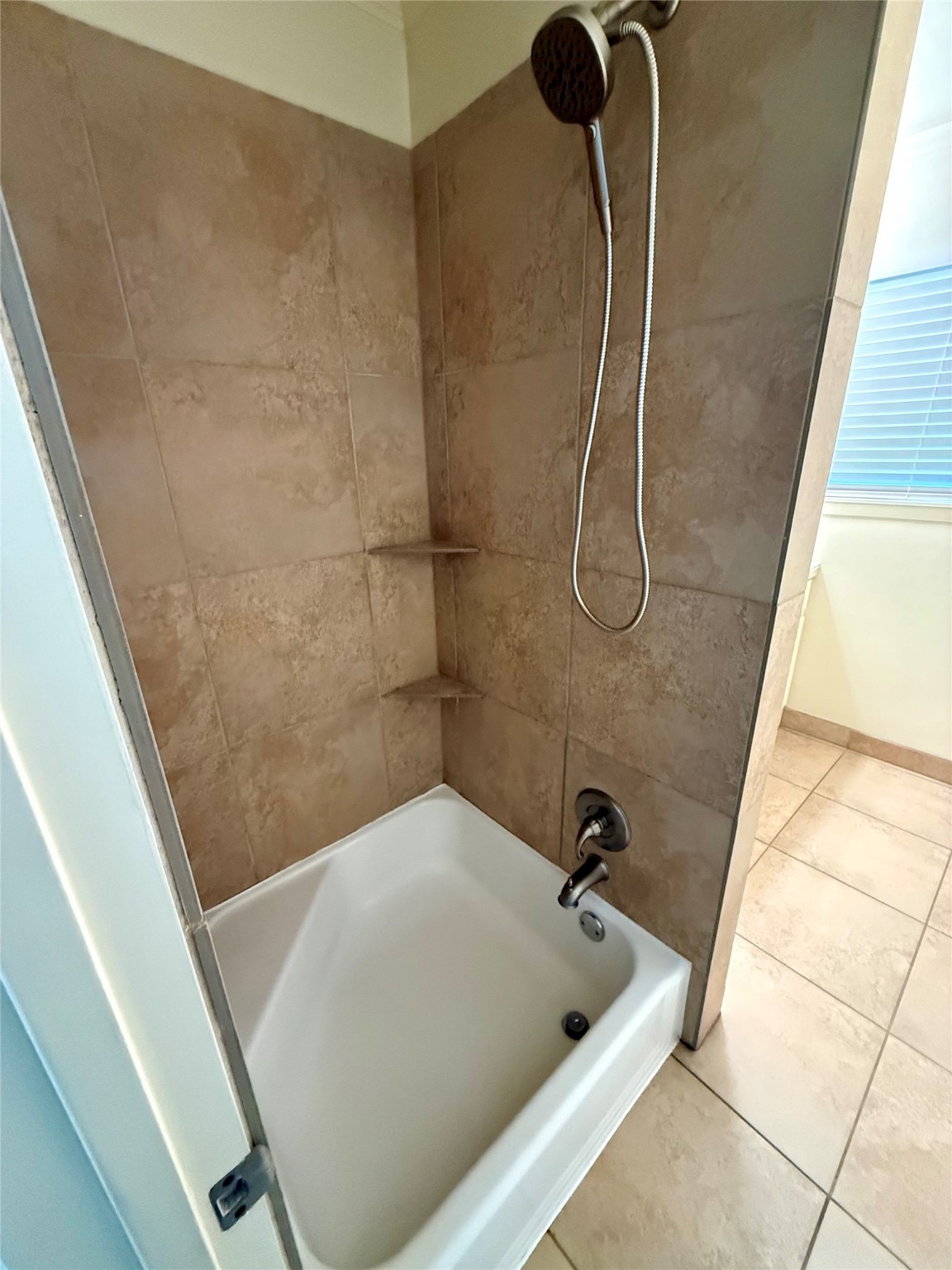 2812 Wichita Street, Unit 6 Houston, TX 77004 - Photo 9 of 15 a bathroom with a bath tub