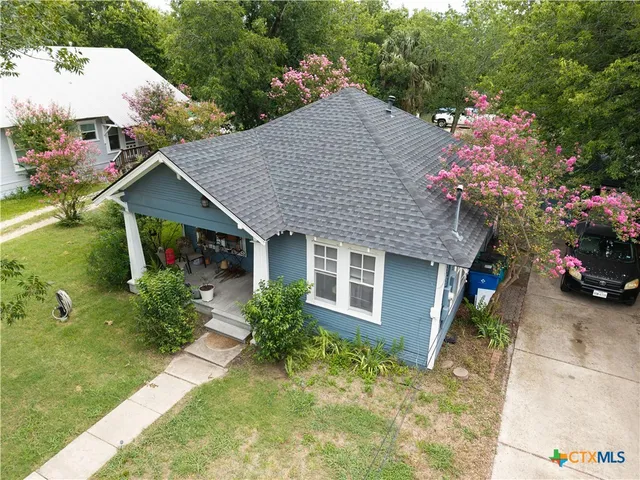 a house view with a garden space