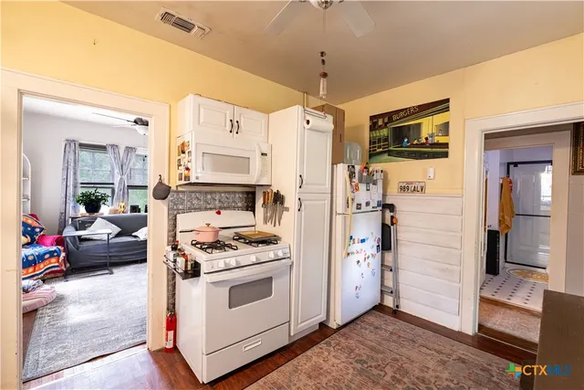 a kitchen with stainless steel appliances a stove and a refrigerator