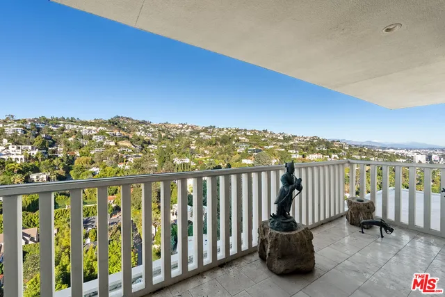 a view of balcony with furniture