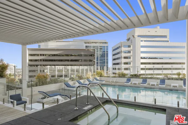 a view of a living room and a floor to ceiling window