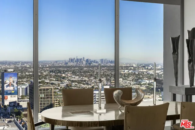 a picture of a very nice looking dining room with a table and chairs