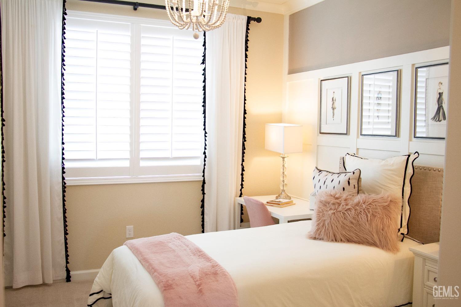 Undisclosed Address Delano, CA 93215 - Photo 4 of 7 a bedroom with a large bed and a window