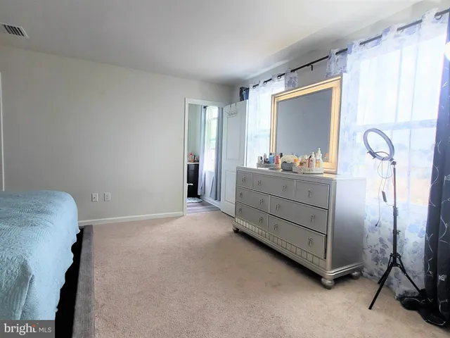 a bathroom with a sink toilet and a mirror