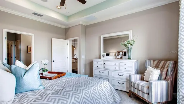 a bedroom with a bed and a dresser