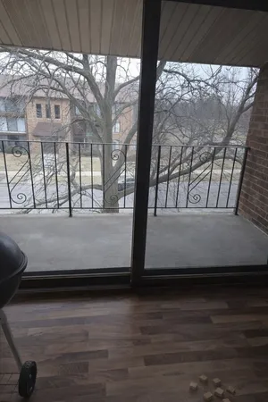 a view of a lake with building and trees in the background