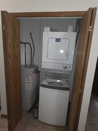 a bedroom with a bed and a closet